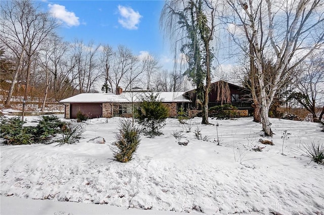 view of yard layered in snow