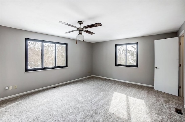 carpeted empty room with ceiling fan