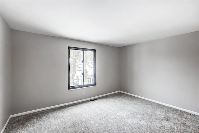 empty room featuring carpet floors