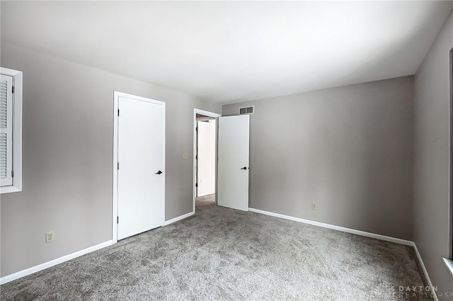 unfurnished bedroom with carpet