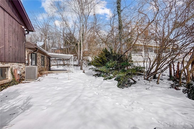 snowy yard with central AC