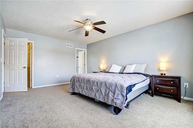 bedroom featuring light carpet and ceiling fan