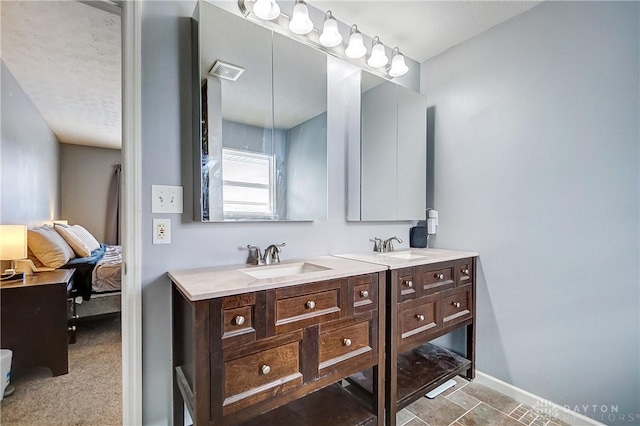 bathroom featuring vanity and a textured ceiling