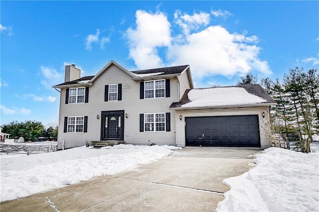 colonial home with a garage