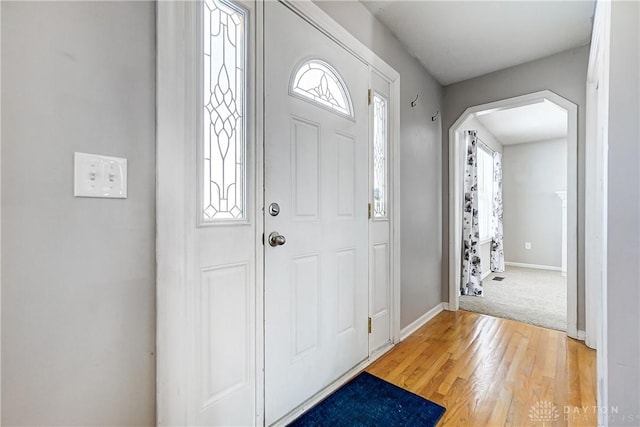 foyer with hardwood / wood-style flooring and a healthy amount of sunlight