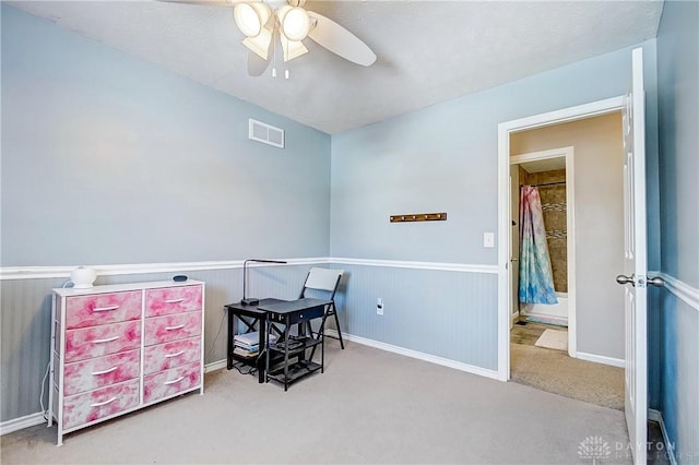 home office featuring ceiling fan and carpet