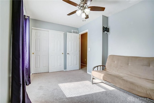 unfurnished room featuring light colored carpet and ceiling fan