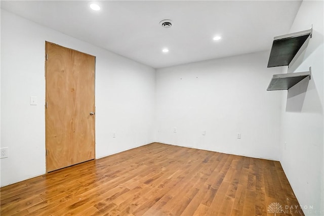 empty room featuring wood-type flooring