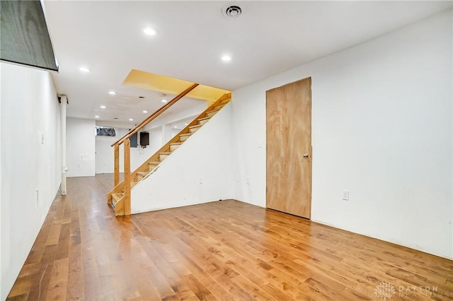 basement featuring hardwood / wood-style flooring