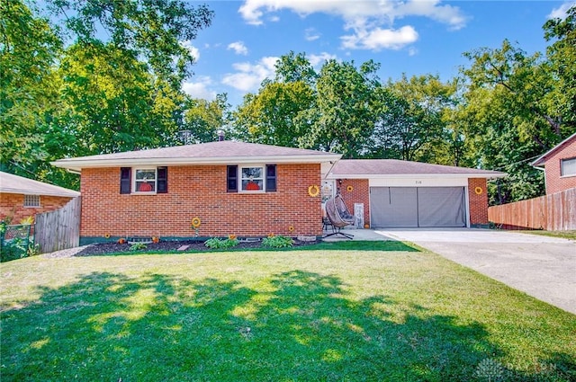 view of front facade with a garage, brick siding, fence, concrete driveway, and a front lawn