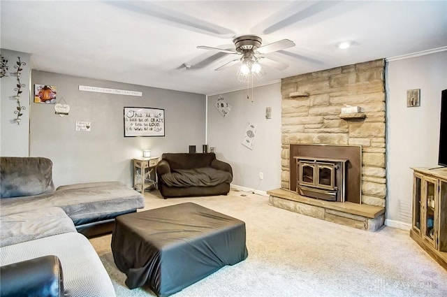 living room with crown molding, ceiling fan, and carpet flooring