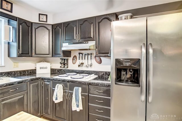 kitchen featuring dark brown cabinetry, white electric stovetop, and stainless steel refrigerator with ice dispenser