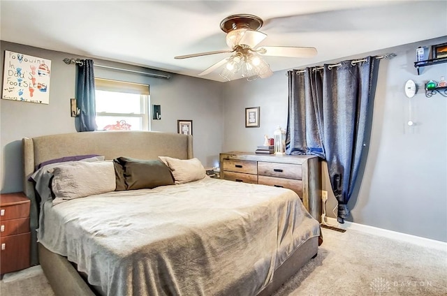 bedroom with ceiling fan and light colored carpet