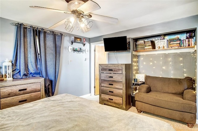 bedroom featuring ceiling fan and light carpet