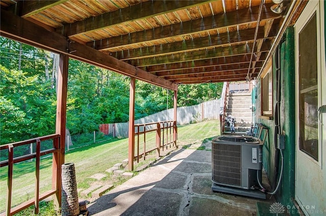 view of patio / terrace featuring stairway, a fenced backyard, and cooling unit