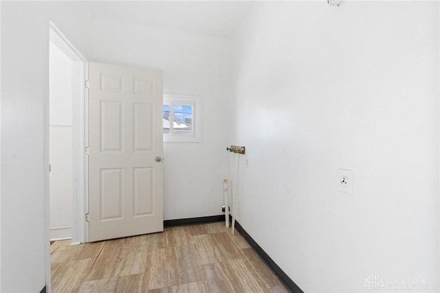 washroom with light hardwood / wood-style flooring