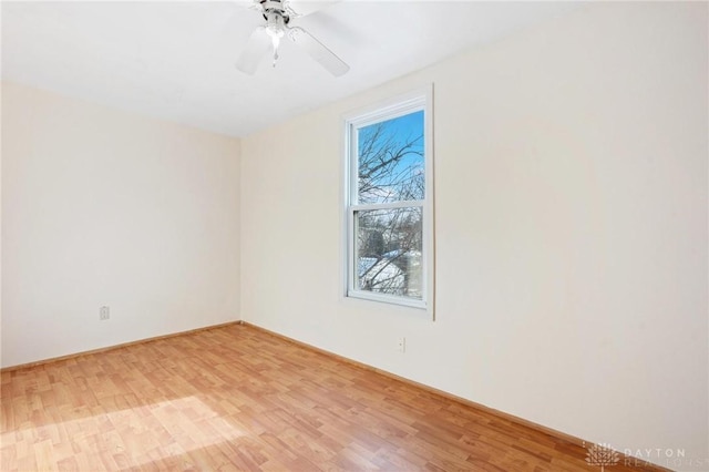 unfurnished room with ceiling fan and light wood-type flooring