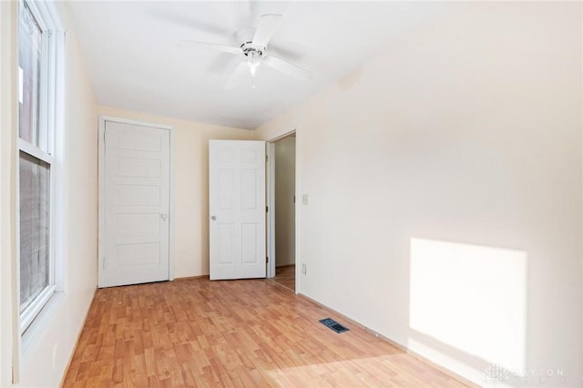 spare room featuring ceiling fan and light wood-type flooring