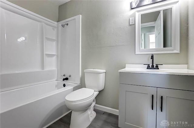 full bathroom featuring vanity, washtub / shower combination, and toilet