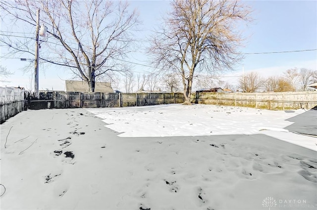 view of yard covered in snow