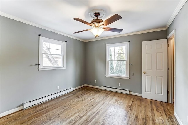 unfurnished bedroom with light wood finished floors, baseboards, a baseboard radiator, ornamental molding, and baseboard heating