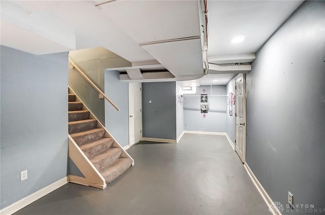 finished basement with baseboards and stairs