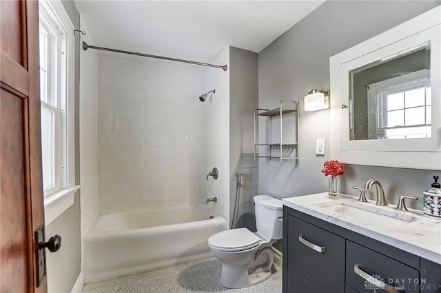 full bathroom with toilet, shower / bath combination, vanity, and tile patterned floors