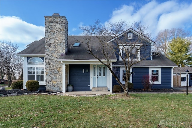 545 E Whipp Rd, Dayton, OH 45459 - view of front of property with a chimney, a front lawn, and a shingled roof