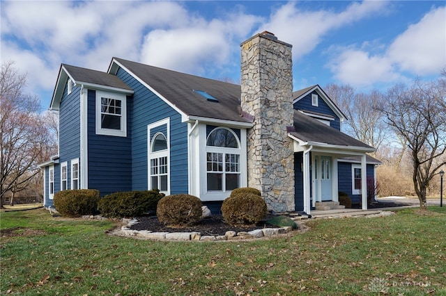 545 E Whipp Rd, Dayton, OH 45459 - view of front facade with a chimney, a front lawn, and a shingled roof