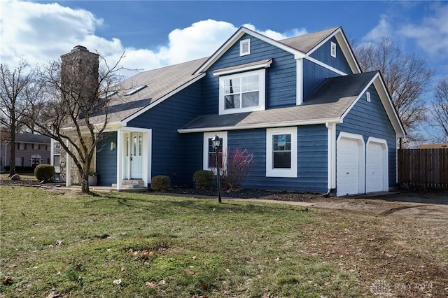 545 E Whipp Rd, Dayton, OH 45459 - view of front of home with a chimney, an attached garage, and a shingled roof
