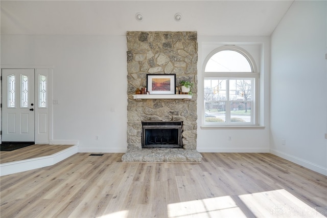 545 E Whipp Rd, Dayton, OH 45459 - unfurnished living room featuring a fireplace, wood finished floors, and baseboards