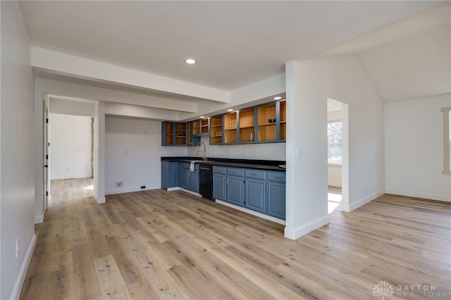 kitchen featuring light wood-style floors, blue cabinetry, dishwasher, open shelves, and dark countertops