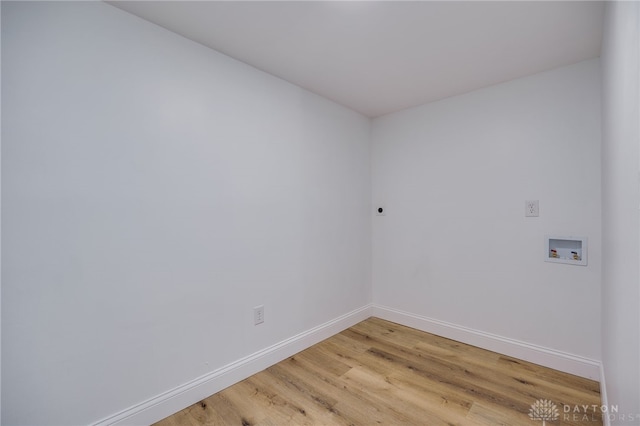 washroom featuring laundry area, washer hookup, baseboards, light wood finished floors, and electric dryer hookup