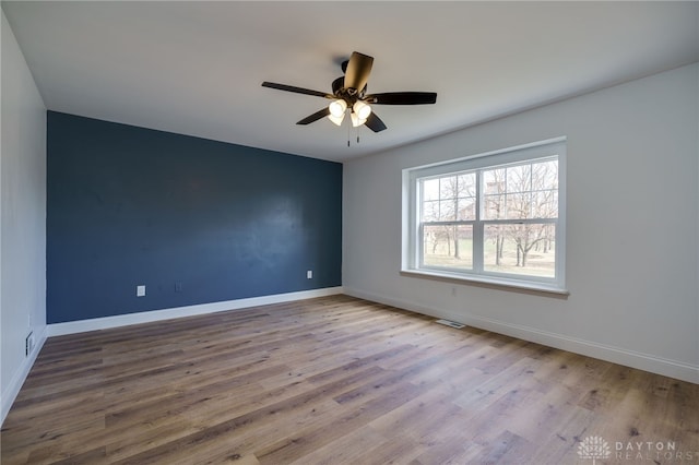 545 E Whipp Rd, Dayton, OH 45459 - spare room featuring wood finished floors, baseboards, and ceiling fan