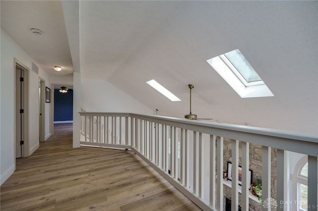 545 E Whipp Rd, Dayton, OH 45459 - hall featuring a skylight, vaulted ceiling, wood finished floors, and baseboards
