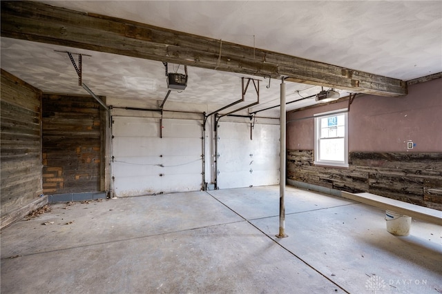 545 E Whipp Rd, Dayton, OH 45459 - garage featuring a garage door opener and wood walls