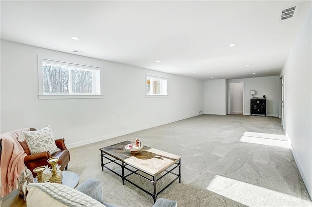 carpeted living room featuring a healthy amount of sunlight