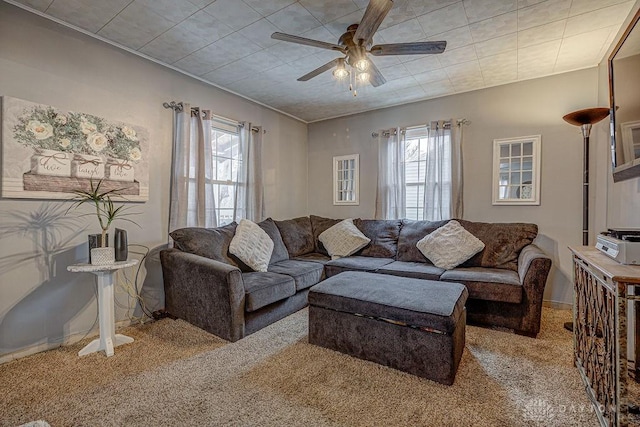 living room with ceiling fan, carpet, and a wealth of natural light