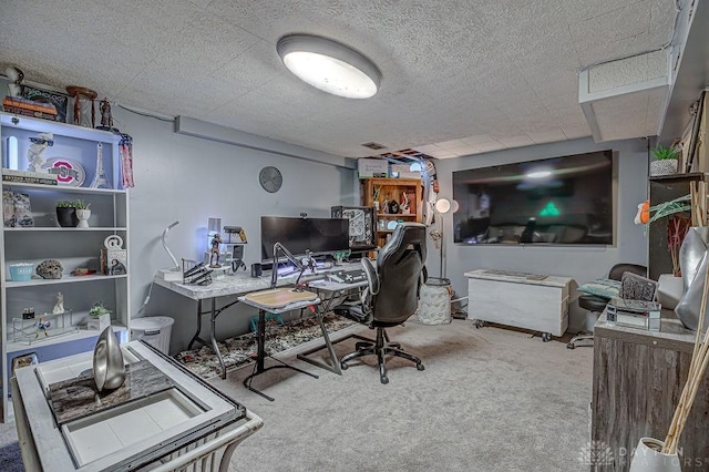 carpeted home office with a textured ceiling