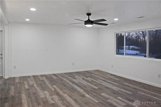 empty room featuring ceiling fan and dark hardwood / wood-style floors