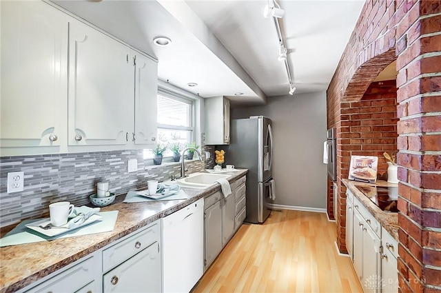 kitchen featuring white cabinetry, dishwasher, rail lighting, black electric stovetop, and light hardwood / wood-style floors