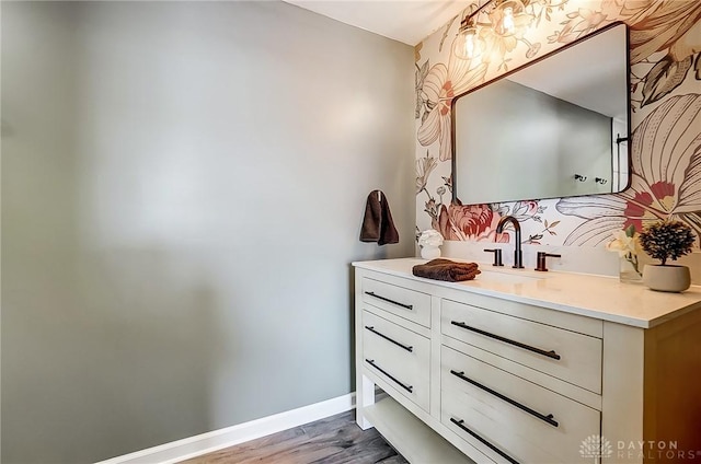 bathroom featuring vanity and hardwood / wood-style flooring