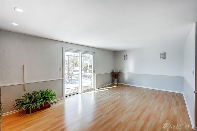 unfurnished room featuring light hardwood / wood-style floors