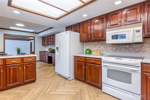 kitchen featuring crown molding, built in desk, white appliances, light parquet flooring, and decorative backsplash