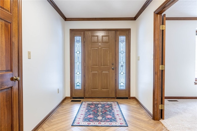 entryway with crown molding and light parquet floors