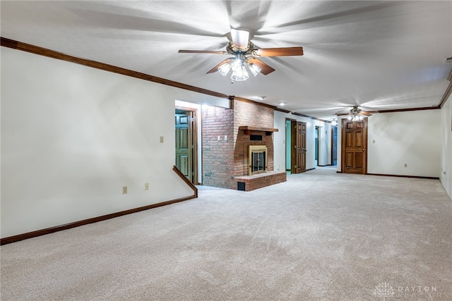 unfurnished living room with ornamental molding, a brick fireplace, light colored carpet, and ceiling fan