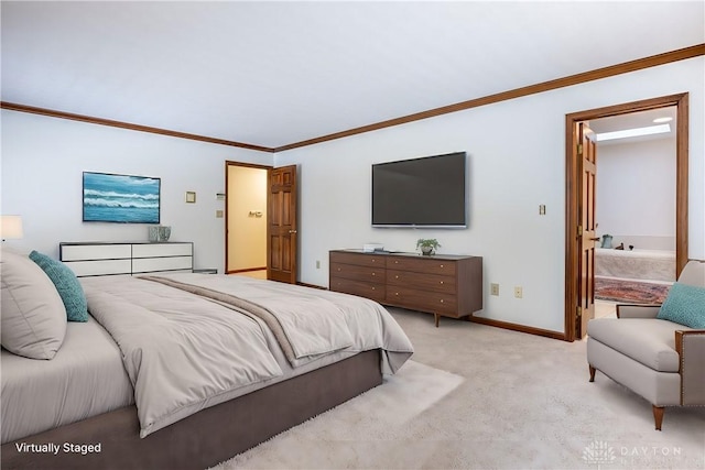 carpeted bedroom featuring crown molding and ensuite bathroom