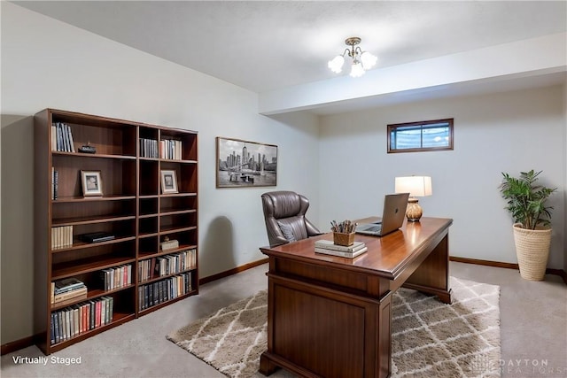 carpeted office space with a chandelier