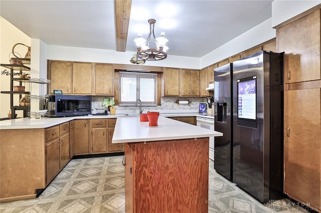 kitchen with white range with electric stovetop, backsplash, a notable chandelier, stainless steel refrigerator with ice dispenser, and beam ceiling