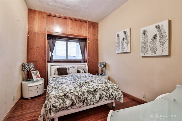 bedroom featuring dark hardwood / wood-style floors